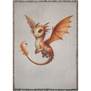 Soft woven tapestry blanket depicting an adorable golden-orange baby fire dragon with warm flame details, open wings, and fringed edges.